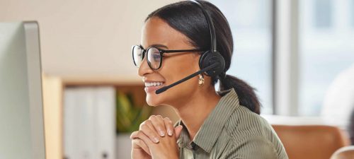 Call center, smile and business woman consulting for crm, contact us and telemarketing in office. Happy, customer service and female consultant with friendly service in online help, support or advice